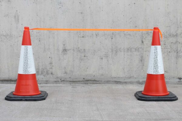 orange fabric traffic tape on cones inline